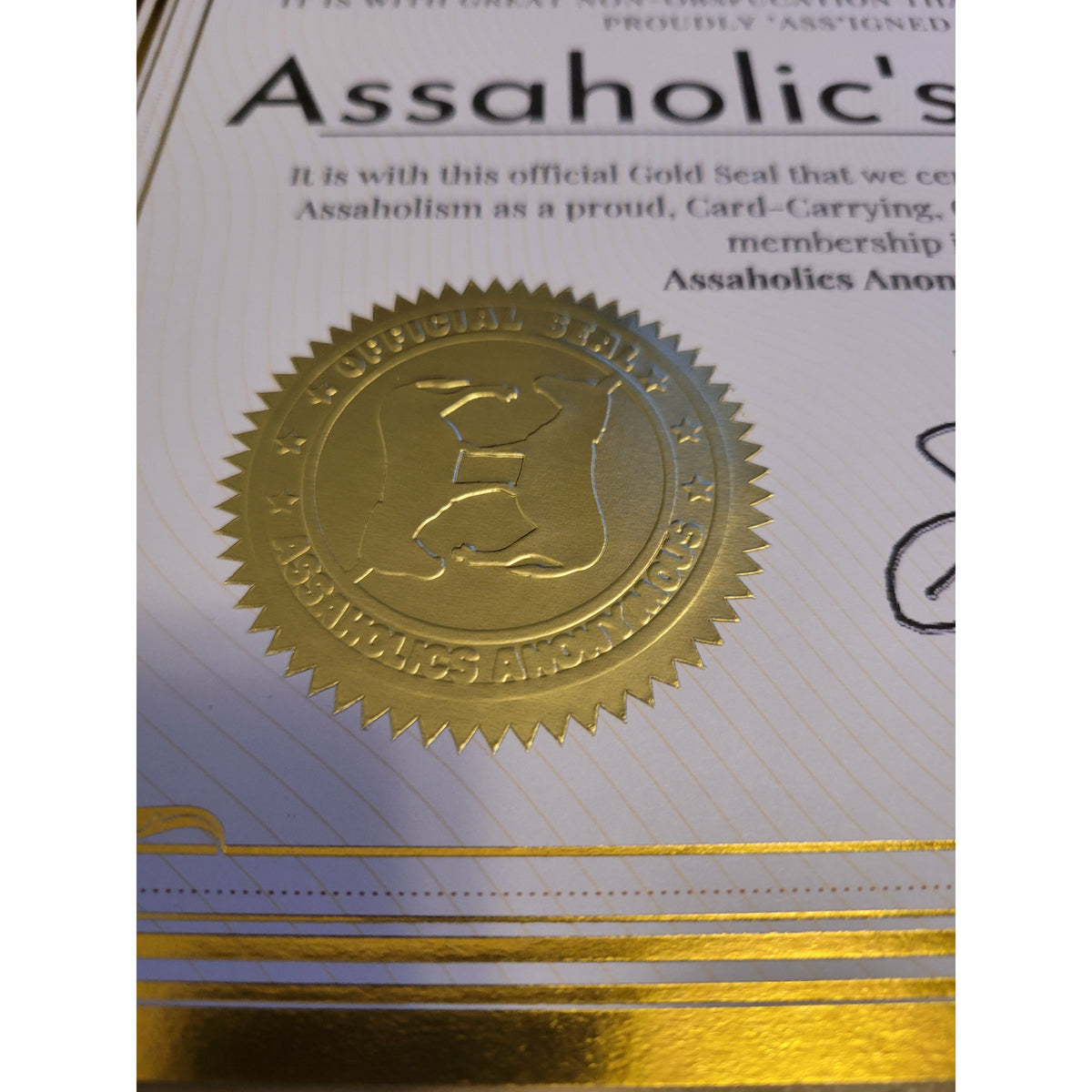It's official with gold foil metallic boarder and embossed gold seal of Assaholics Anonymous.